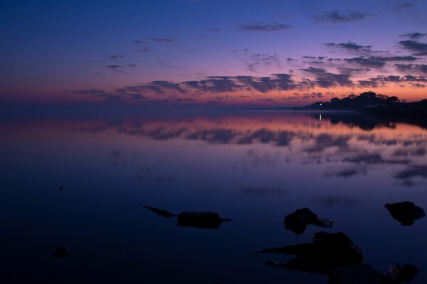 Sunrise over the lake in reflection