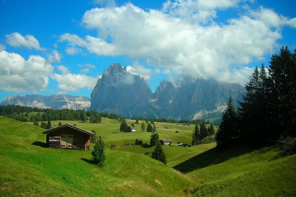 A lonely house on the background of mountains