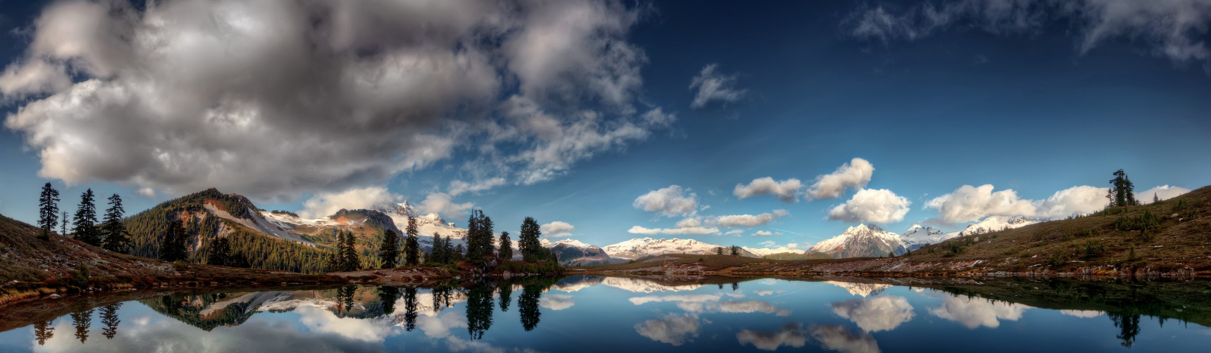 lago montagne riflessione nuvole panorama