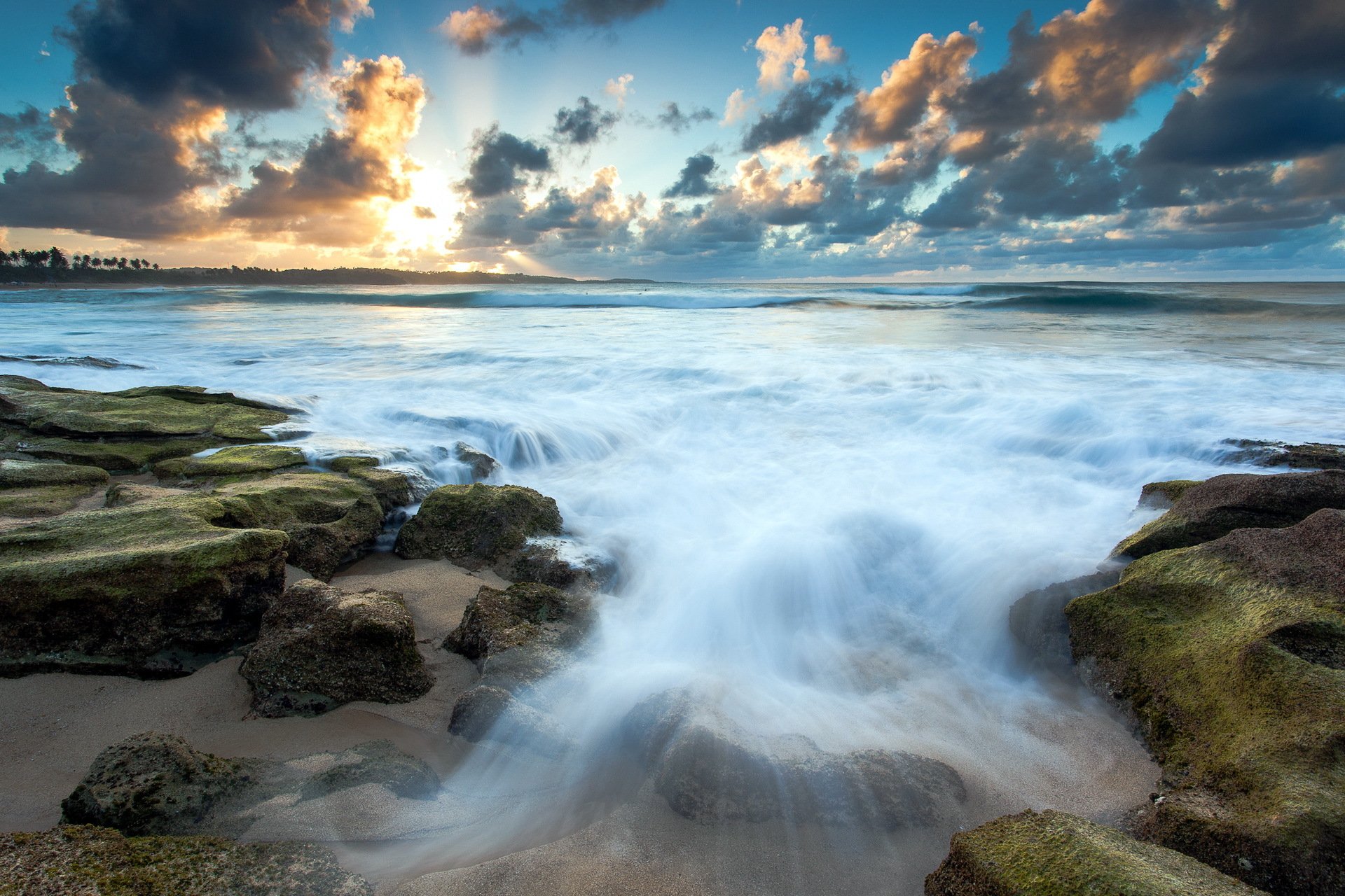 coucher de soleil mer pierres