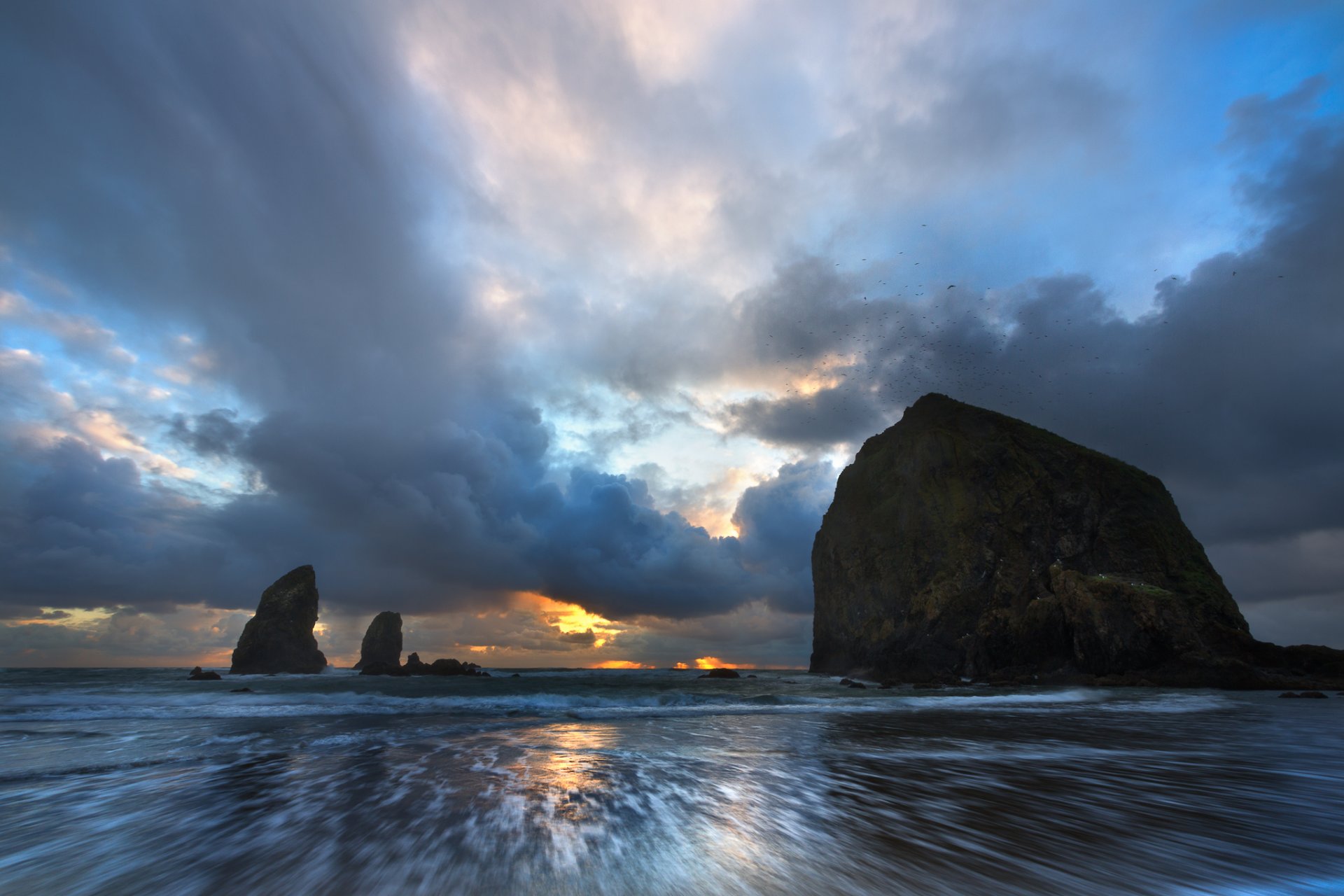 cannon beach oregon coast beach rock dawn