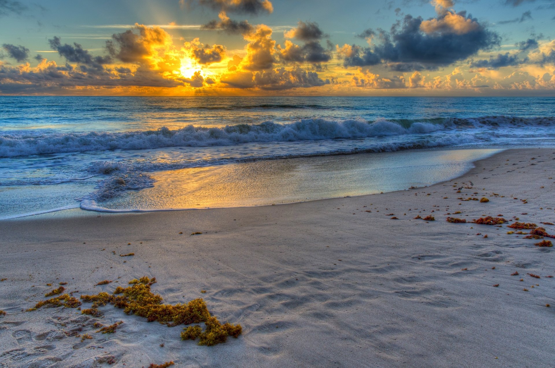 beach sand water waves sun sky cloud