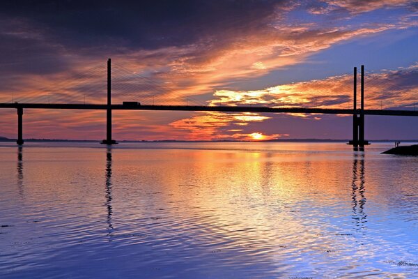 Long bridge over the evening river