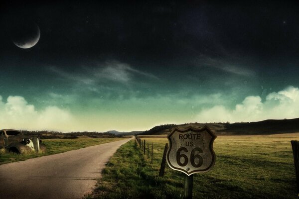 A deserted night road among fields and hills