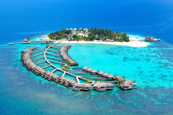 A resort island in the sea with a pier