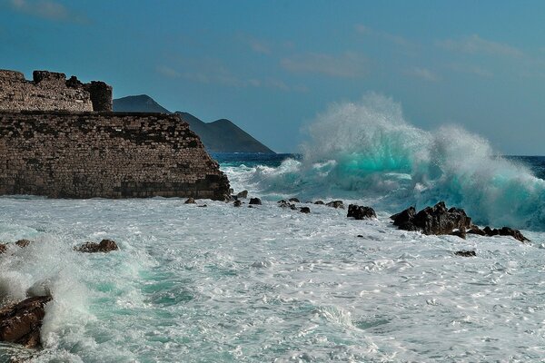 Waves lapping at the repost ruins