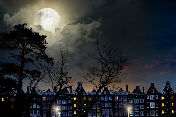 Night city landscape under the moon