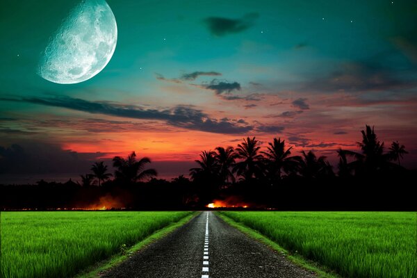 The road goes into a blazing sunset in the moonlight
