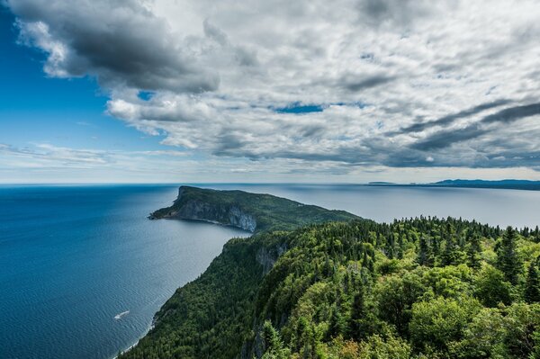 Cape stretching into the sky among the water