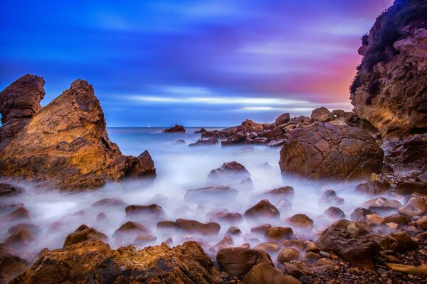 California: Sunrise on the rocky ocean beach
