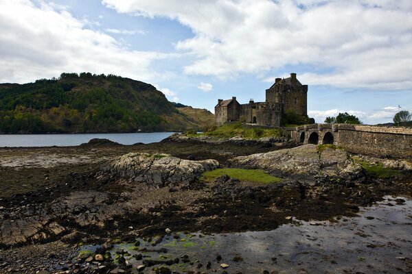 The castle across the bridge and the scenic landscape