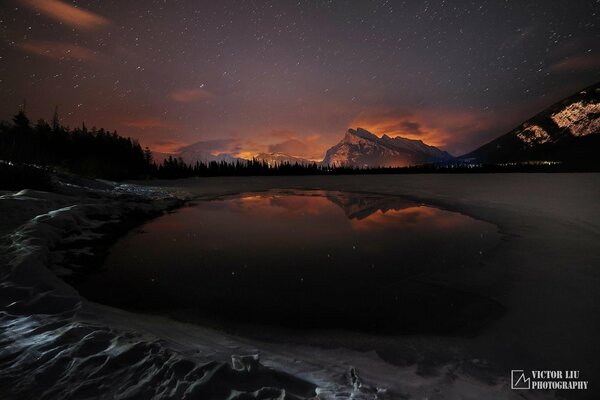 Night glow in winter in the forest