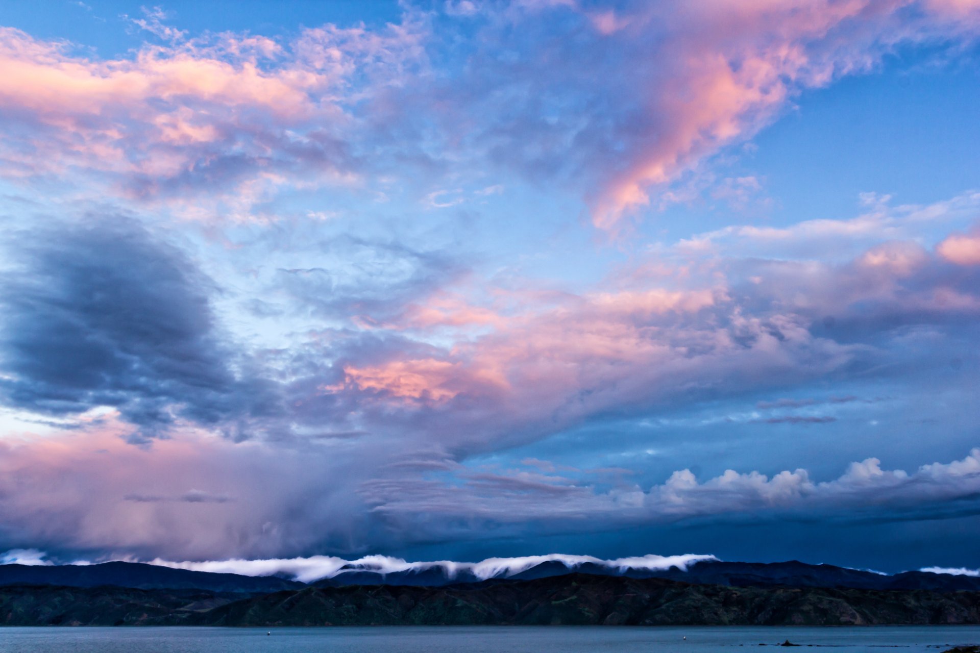 new zealand wellington bay mountains blue sky clouds evening strait blue