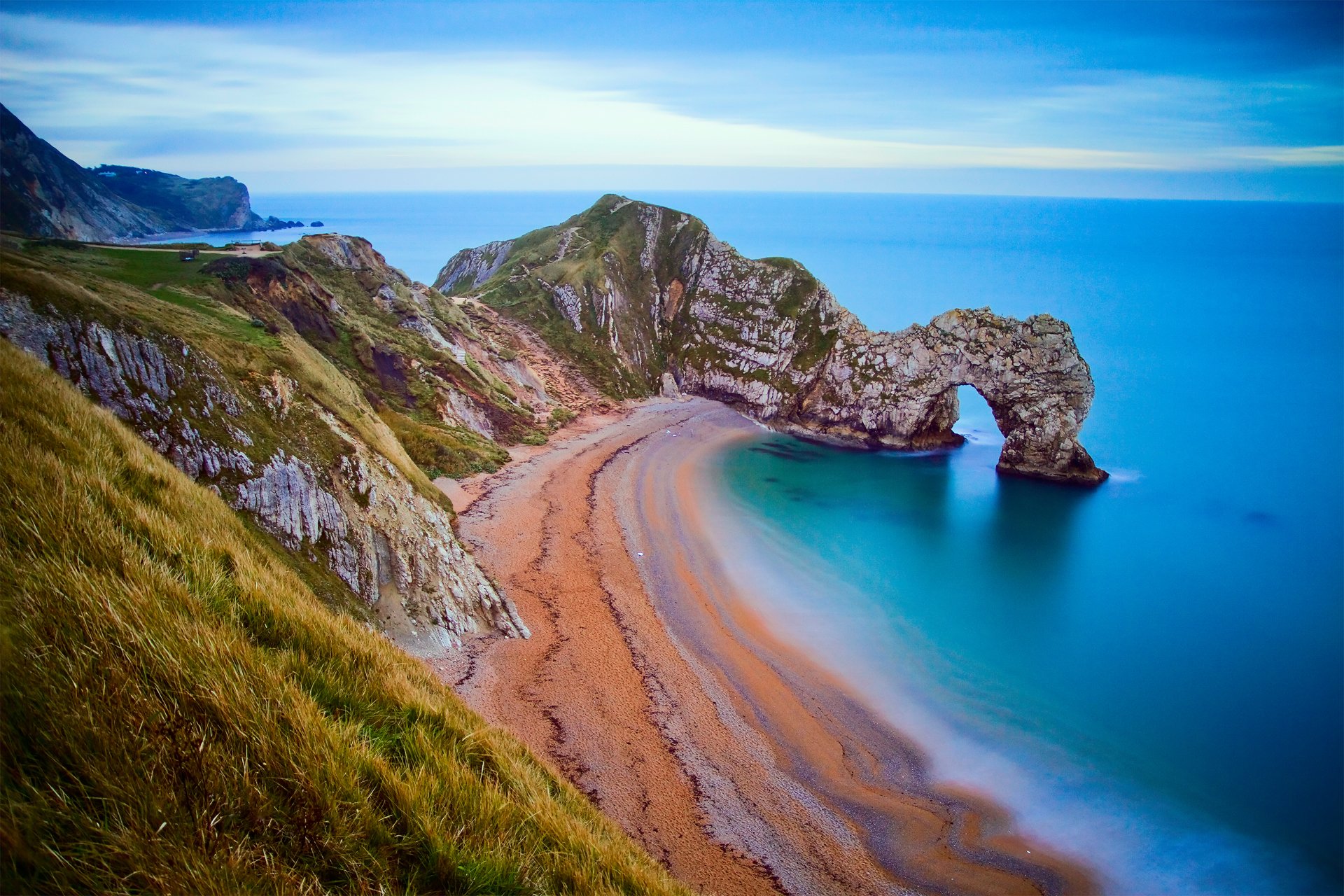 arch rocks beach sky shore