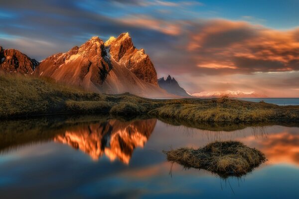 Evening sunset in the mountains by the lake