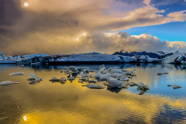 Winter. ice on the water. the sky is in the clouds